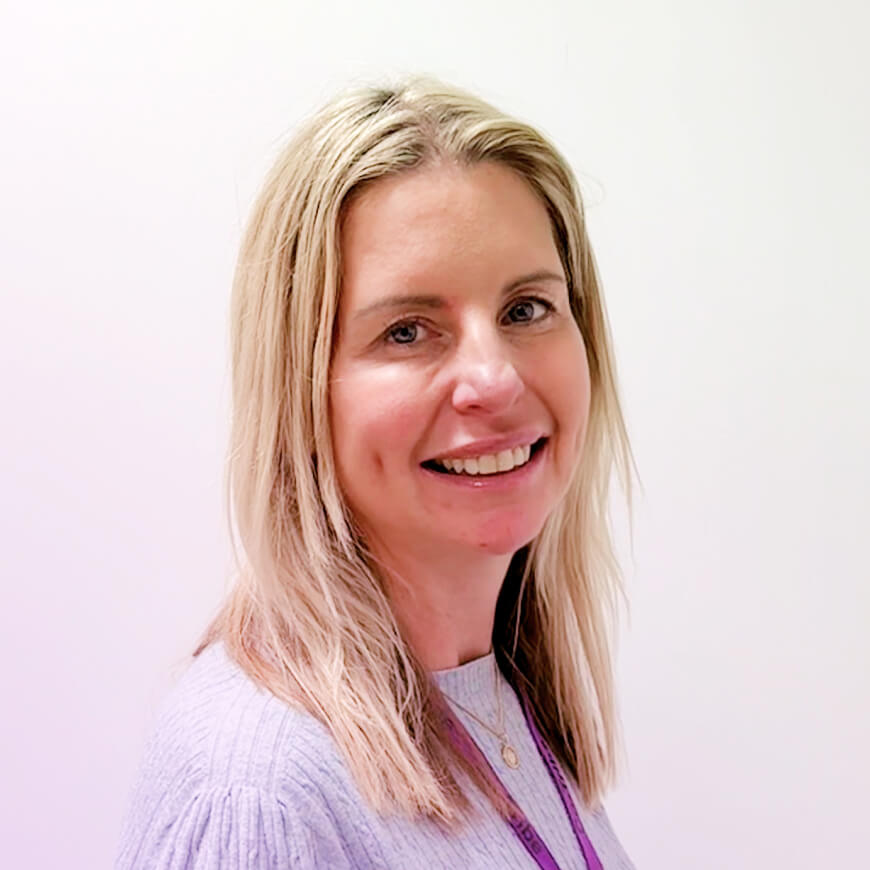 Portrait photo of Rhona, she has blonde hair and a big smile
